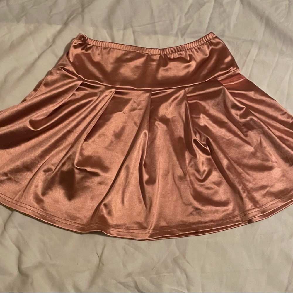 Pink pleated skirt better be